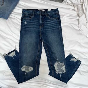 High rise destroyed denim